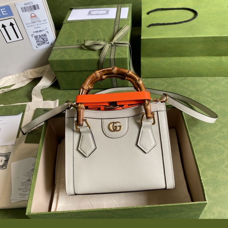 G*u*i top handle bags